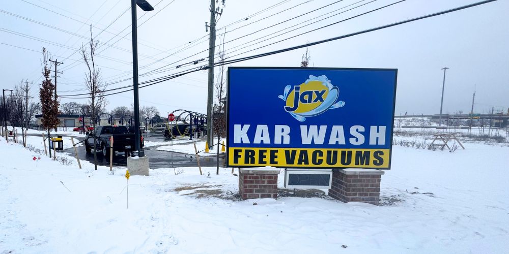 Jax Car Wash Madison Heights sign with free vacuums