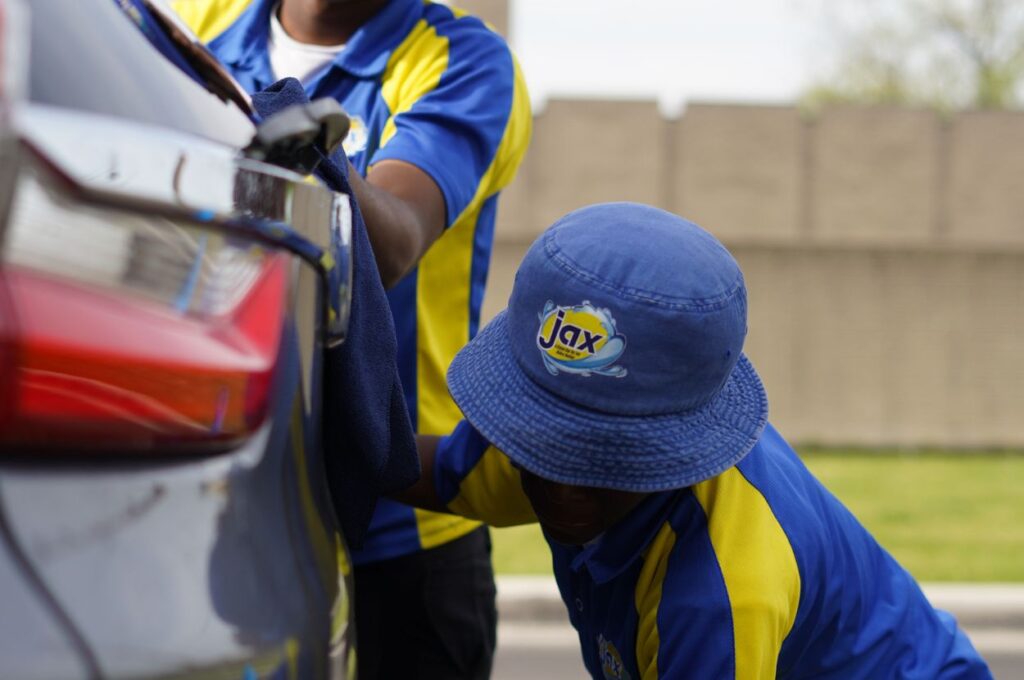 Jax Kar Wash staff polishing vehicle paint Birmingham