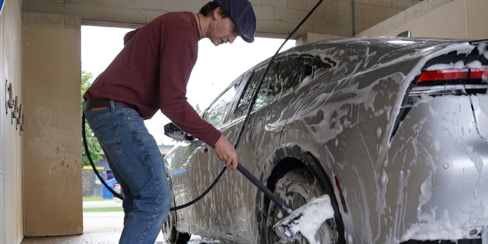 Manual car wash pre-soak at Jax Kar Wash