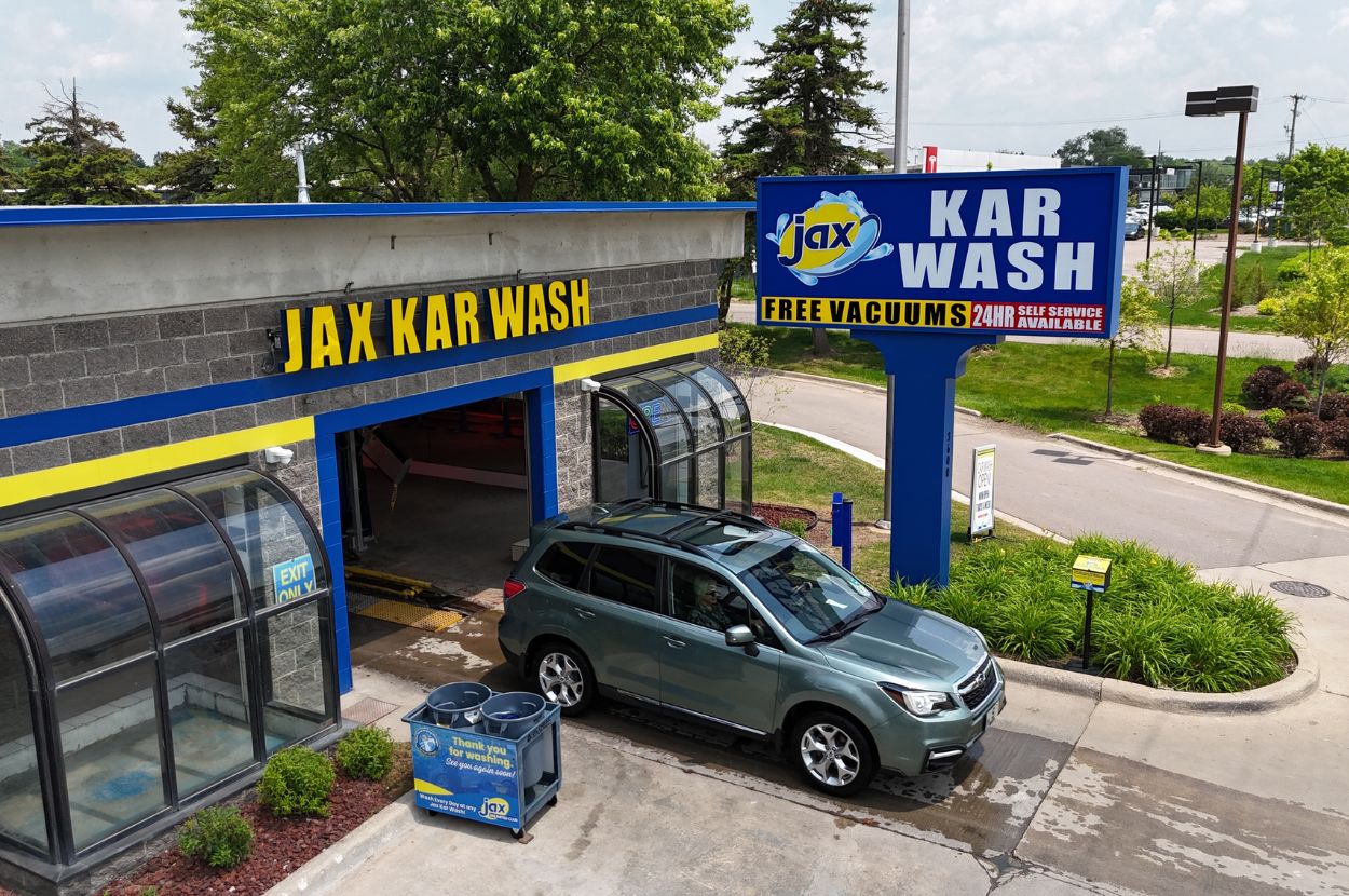 Car exiting Jax Kar Wash with free vacuums