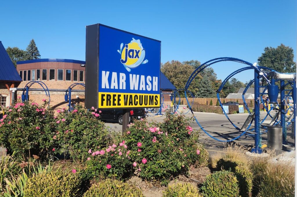 Jax Kar Wash sign with free vacuums and stations