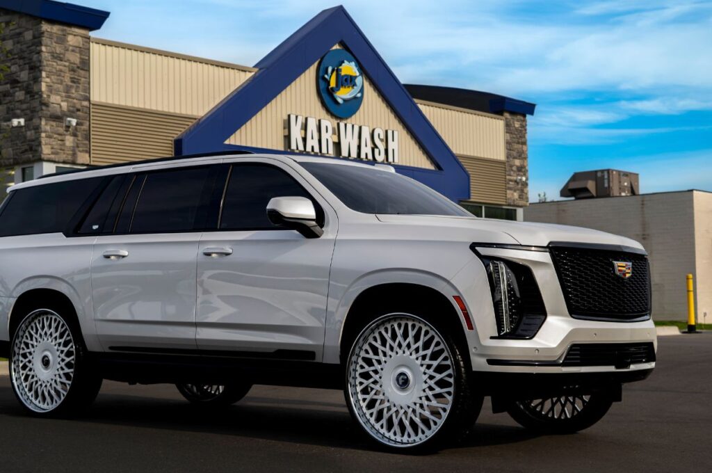 White SUV parked outside Jax Kar Wash building