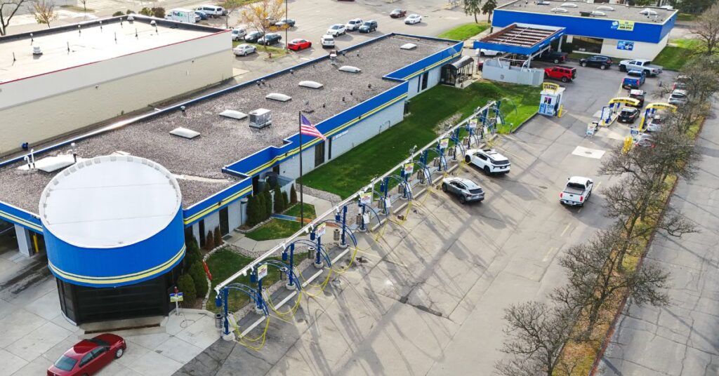 Aerial view of car wash with vacuum stations and bays