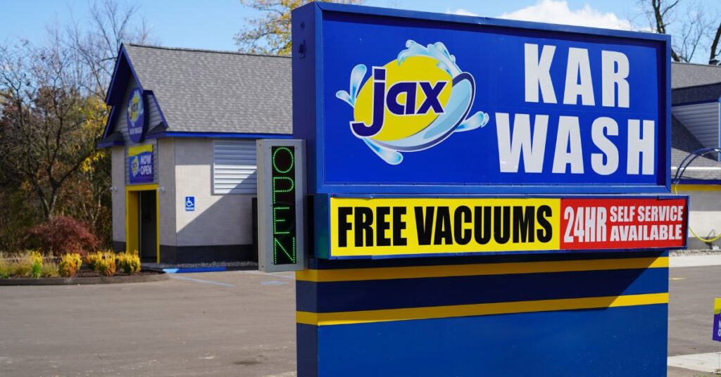 Jax car wash sign advertising free vacuums and service