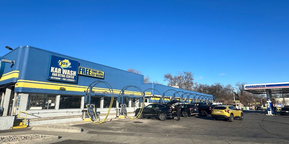 Jax Kar Wash exterior with vacuum stations and cars.