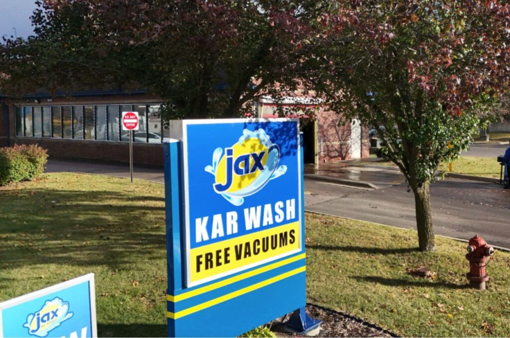 Jax Kar Wash exterior sign beside roadside entrance
