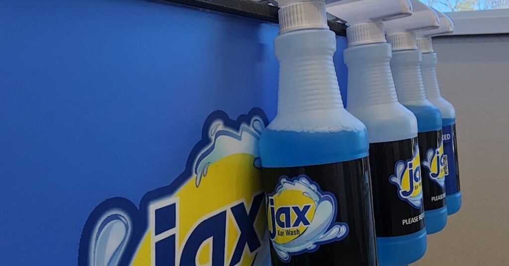Line of Jax Karwash spray bottles.