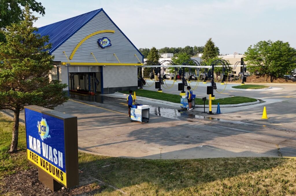 Jax Kar Wash exterior featuring a sign and vacuum stations.